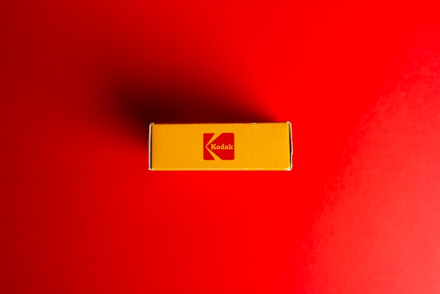 A box of an old Kodak film with a red background.